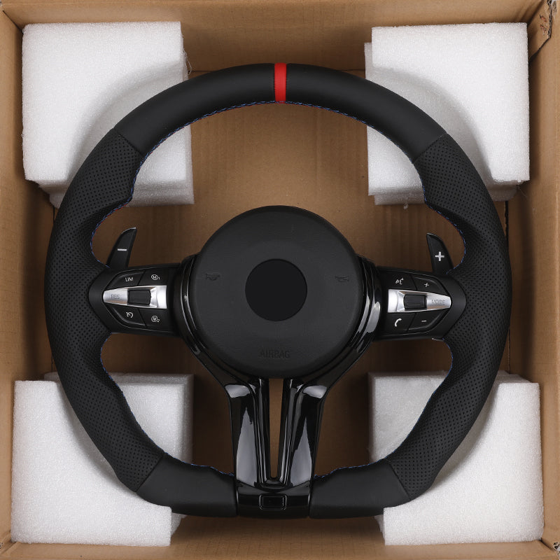 BMW carbon fiber steering upgrade wrapped steering wheel with control buttons in packaging box