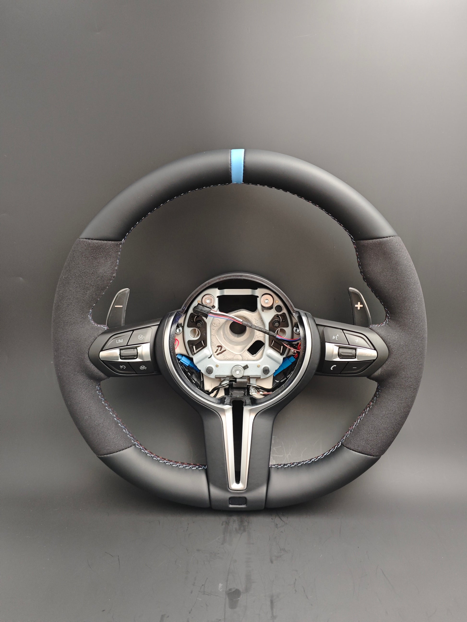 Custom BMW steering wheel upgrade with leather and Alcantara grip and blue center stripe