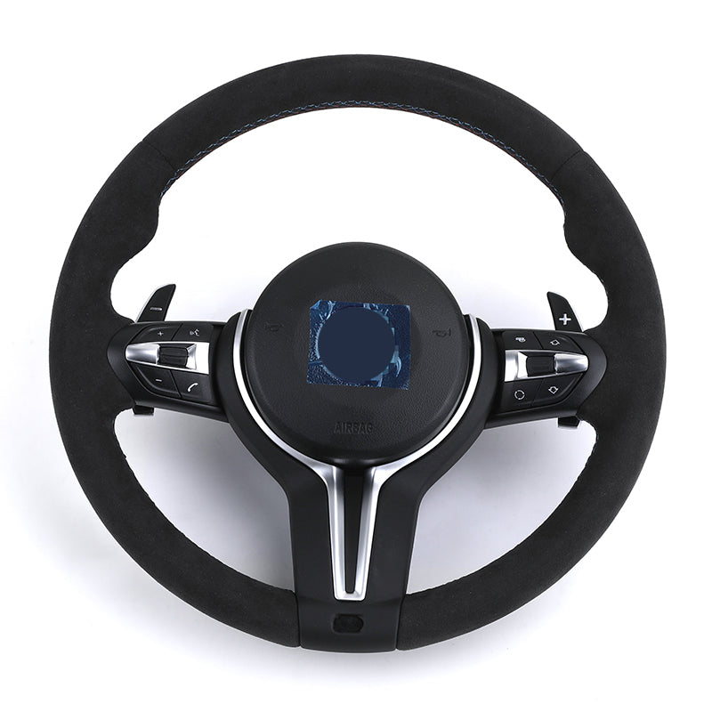 BMW forged carbon steering wheel with black suede grip and integrated control buttons