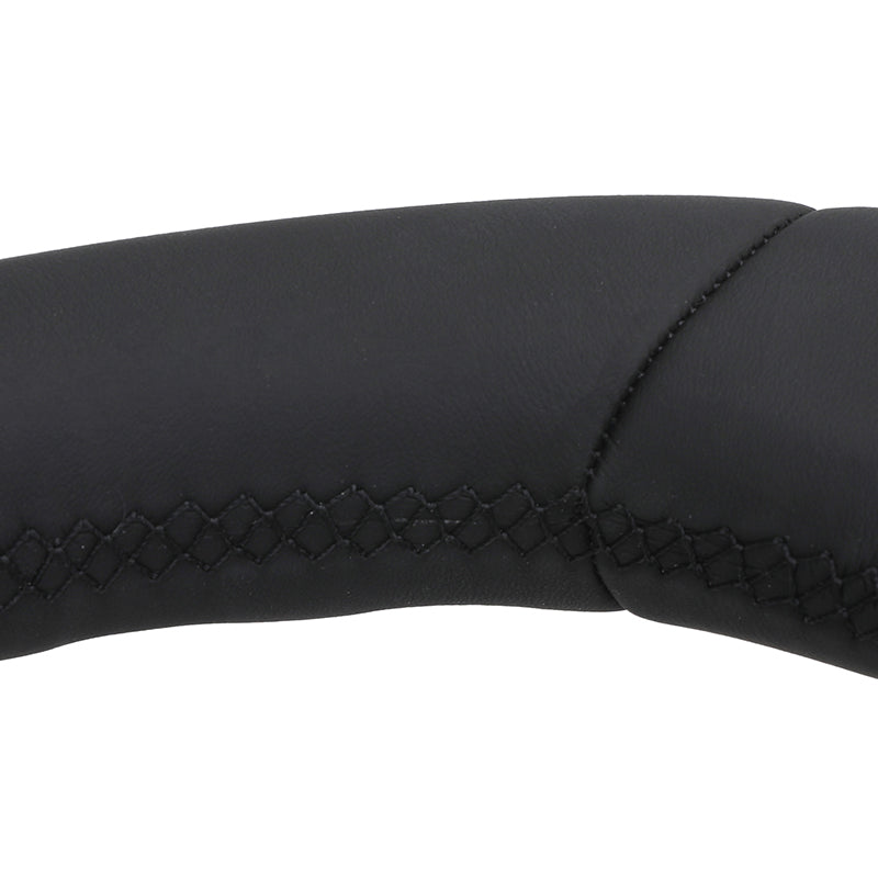 Close-up of black leather stitching detail on BMW forged carbon steering wheel