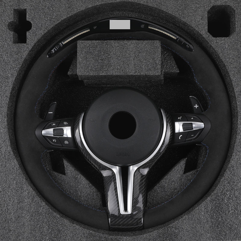 BMW forged carbon steering wheel with control buttons in protective foam packaging