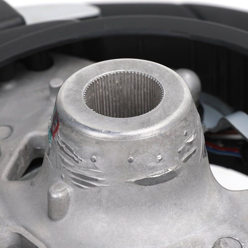 Close-up of BMW forged carbon steering wheel hub connector showing detailed metal texture