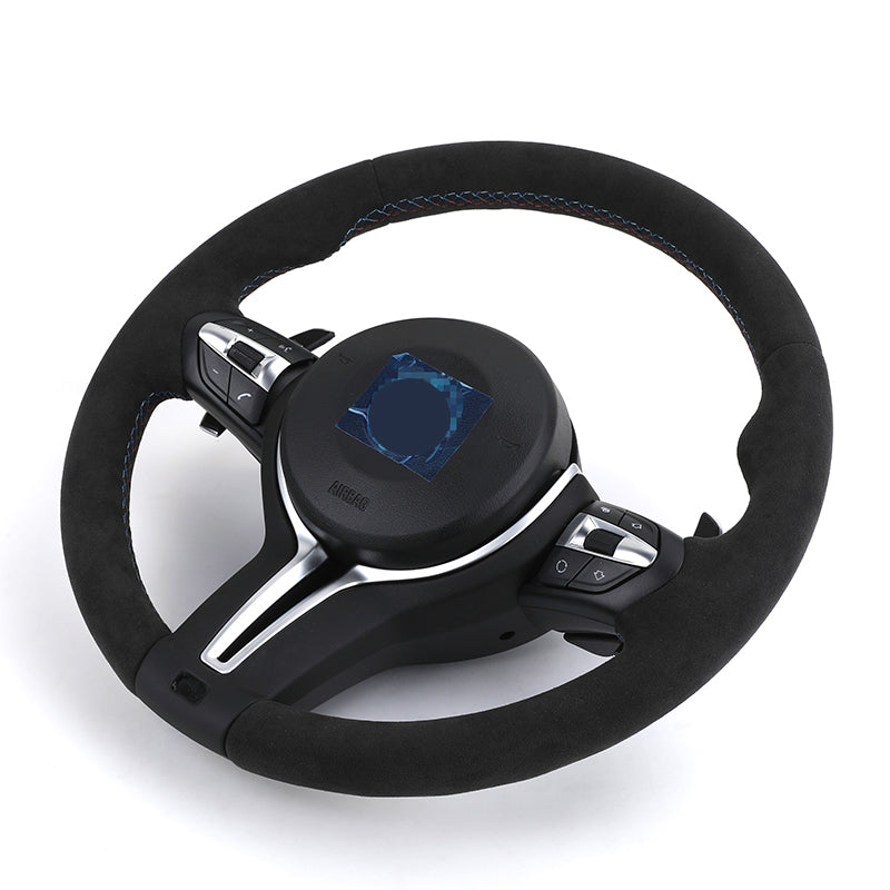 Custom BMW steering wheel upgrade with black suede finish and integrated control buttons