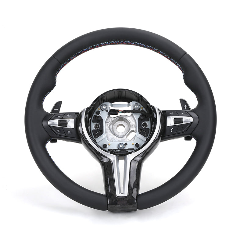 Black steering wheel with silver accents on a white background