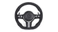 Black steering wheel with silver accents on a white background