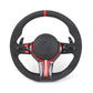 Black steering wheel with red accents on a white background