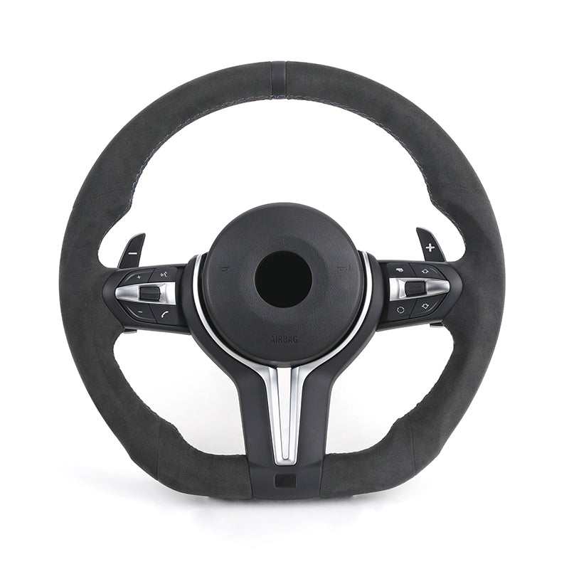 Black steering wheel with silver accents on a white background