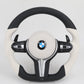 BMW steering wheel with black and white design on a light gray background