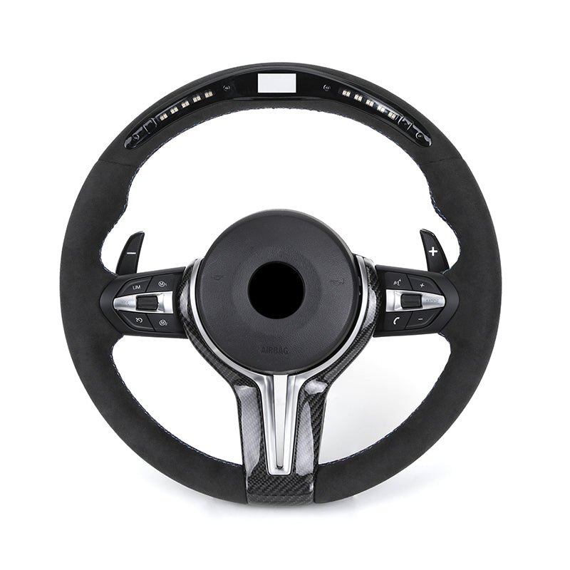 Black steering wheel with silver accents on a white background