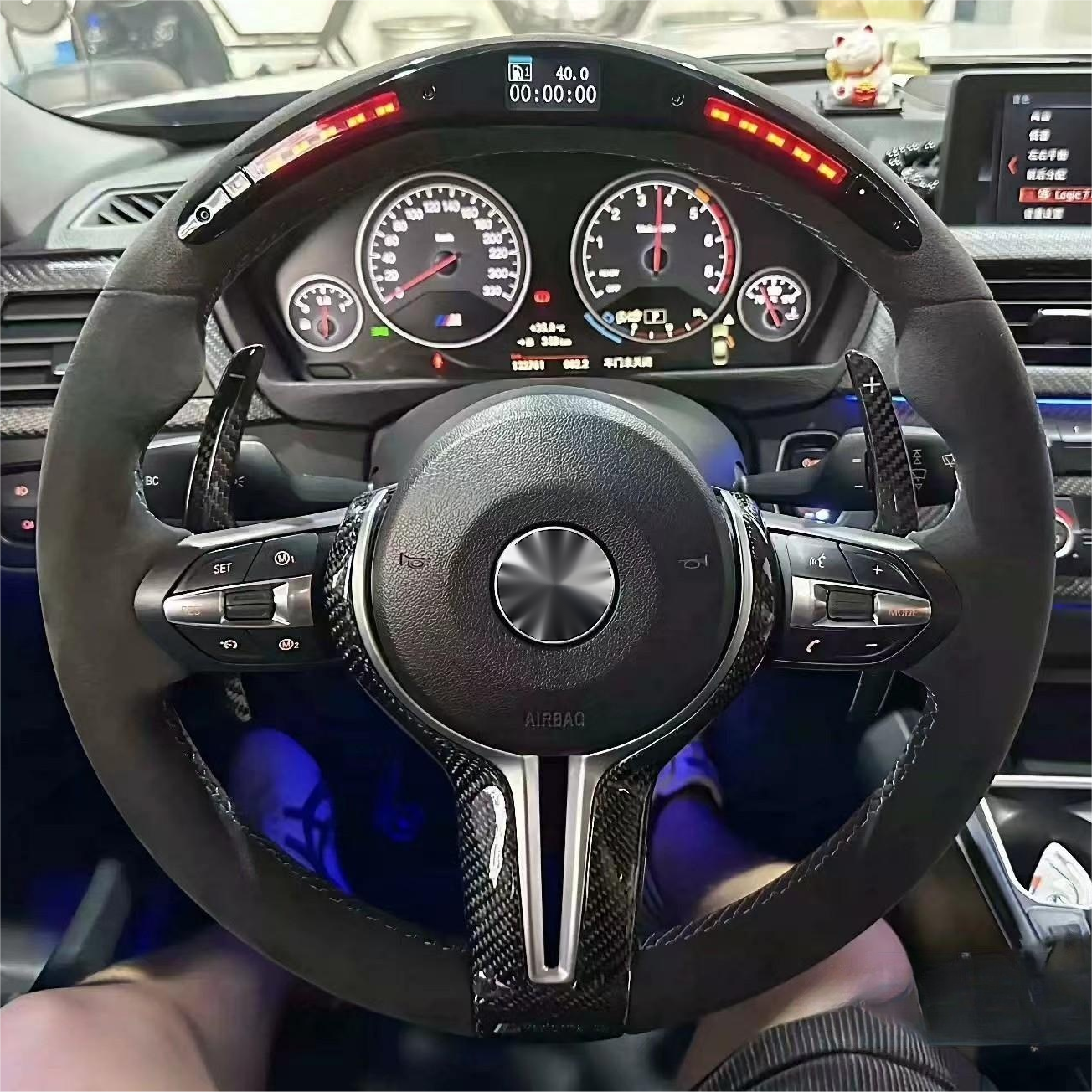 Steering wheel and dashboard of a car with digital display