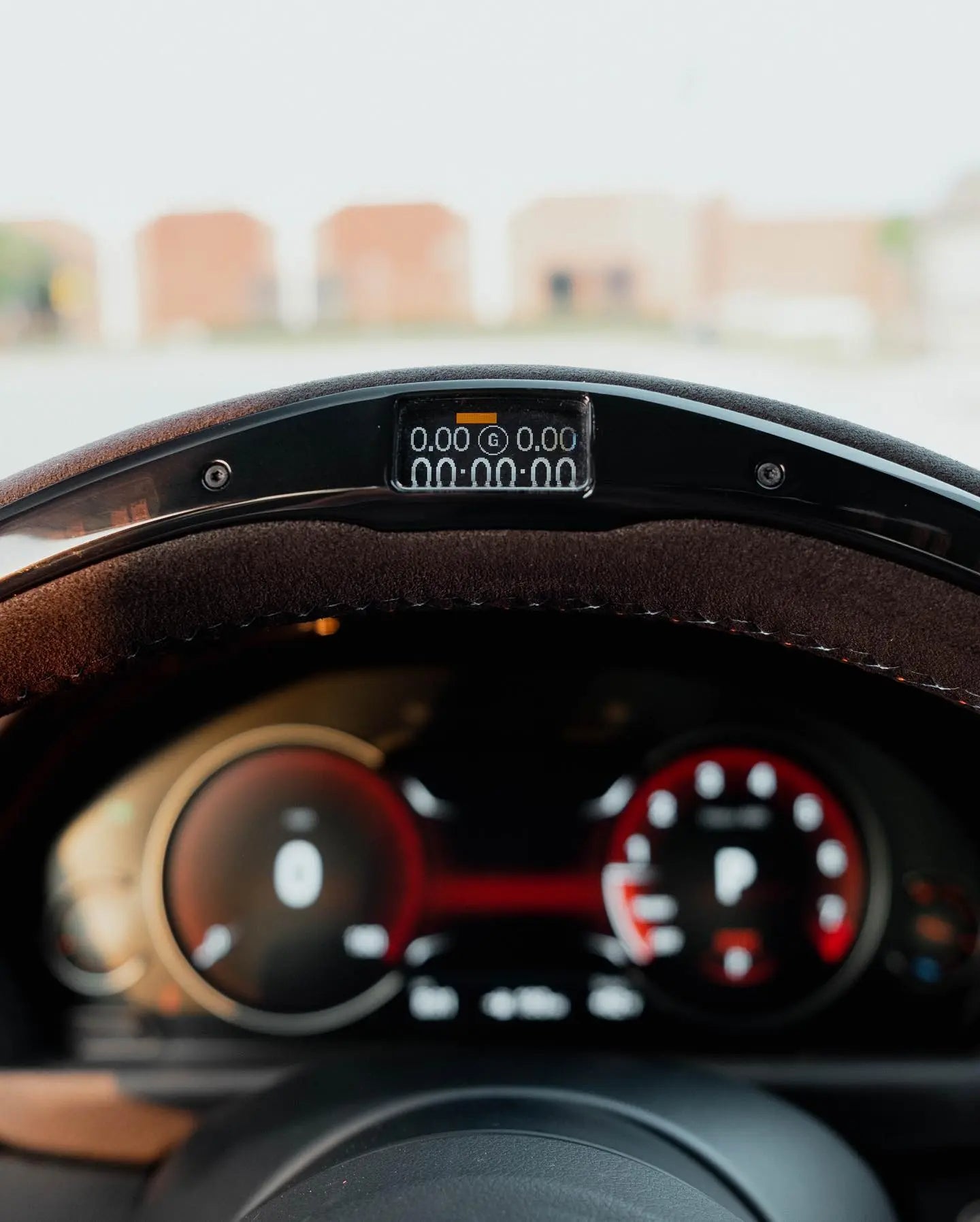 Close-up of a car's instrument cluster with a blurred background