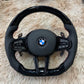 Forged carbon fiber steering wheel BMW with black leather grips and multifunction control buttons