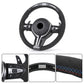 BMW forged carbon steering wheel with suede grip, multi-function controls, and detailed stitching
