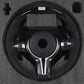 BMW forged carbon steering wheel with control buttons in protective foam packaging