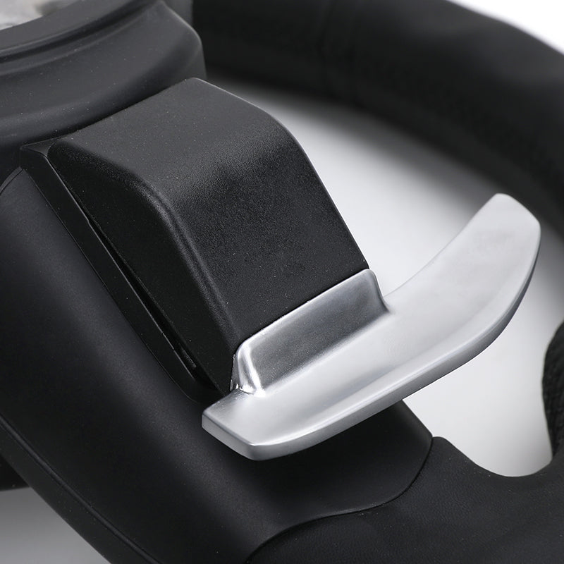 Close-up of BMW forged carbon steering wheel paddle shifter in black and silver finish