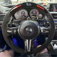 BMW steering wheel with carbon fiber accents showcasing BMW interior performance accessories