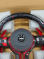 BMW performance steering wheel replacement with red stitching and carbon fiber design in protective packaging